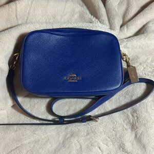 Navy blue. Coach purse. Crossbody strap.